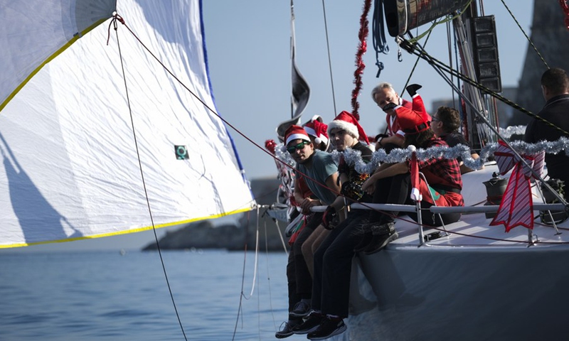 People take part in the traditional Boxing Day Fun Race for charity in Ta' Xbiex, Malta, on Dec. 26, 2022.(Photo: Xinhua)