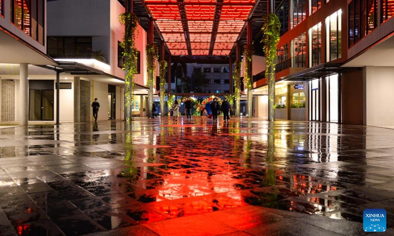 People walk on a street decorated with illuminations in Jakarta, Indonesia, Dec. 28, 2022. As the year 2023 is approaching, colorful lights have been installed in Jakarta to add a festive atmosphere ahead of the new year.(Photo: Xinhua)