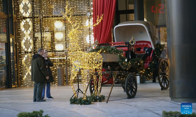 People look at New Year's light decorations in Ankara, Türkiye, Dec. 30, 2022. (Photo by Mustafa Kaya/Xinhua)