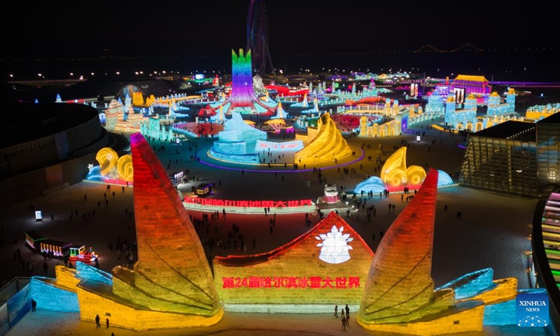 This aerial photo taken on Dec. 31, 2022 shows tourists visiting the Harbin Ice-Snow World in Harbin, northeast China's Heilongjiang Province. (Xinhua/Zhang Tao)