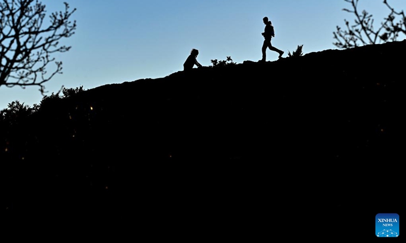 People hike on Vodno mountain in Skopje, North Macedonia, Jan. 2, 2023. (Photo by Tomislav Georgiev/Xinhua)