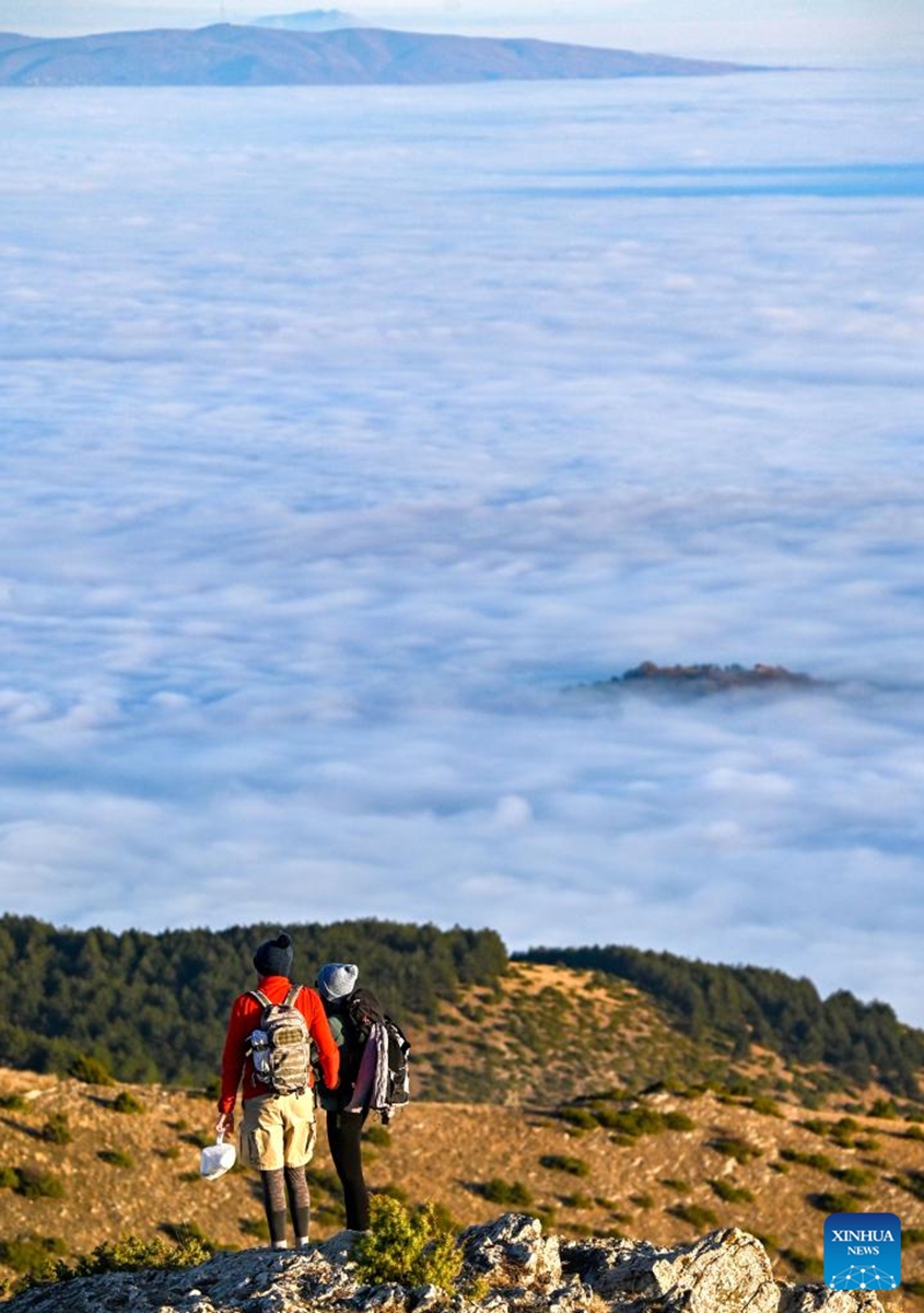 People hike on Vodno mountain in Skopje, North Macedonia, Jan. 2, 2023. (Photo by Tomislav Georgiev/Xinhua)