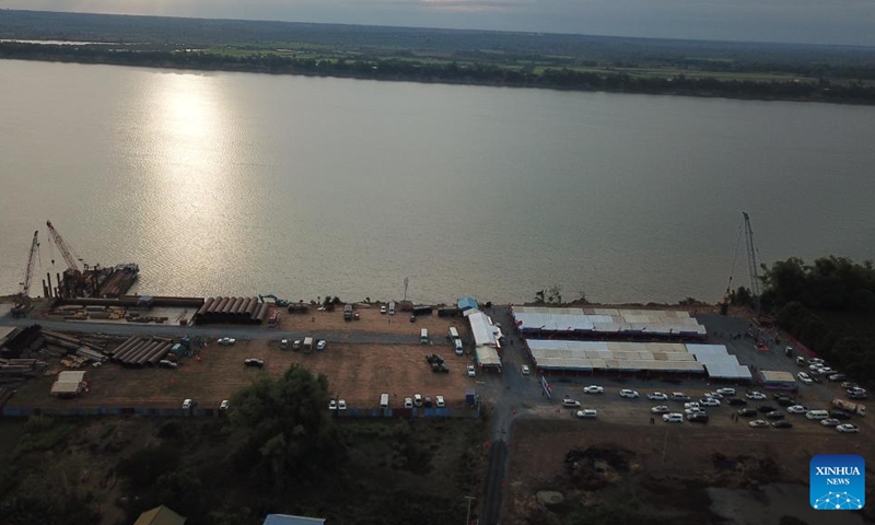 This aerial photo taken on Jan. 1, 2023 shows the construction site of a China-funded bridge in Kratie province, Cambodia. Cambodia on Monday broke ground for the construction of a bridge across the Mekong River here in the country's northeastern part, with funds from China. (Photo by Van Pov/Xinhua)