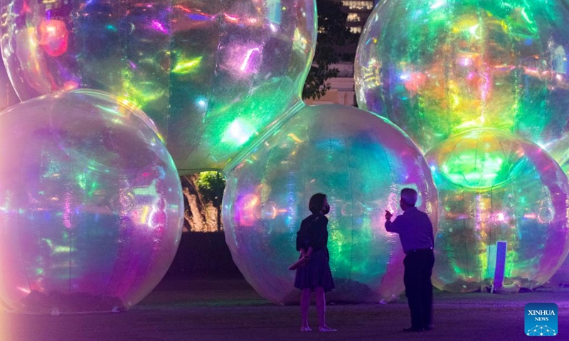 People view light installations during a media preview of the Light to Night Festival at Singapore's Civic District, Jan. 4, 2023. The Light to Night Festival will be held from Jan. 6 to 26 in various locations in the Civic District.(Photo: Xinhua)