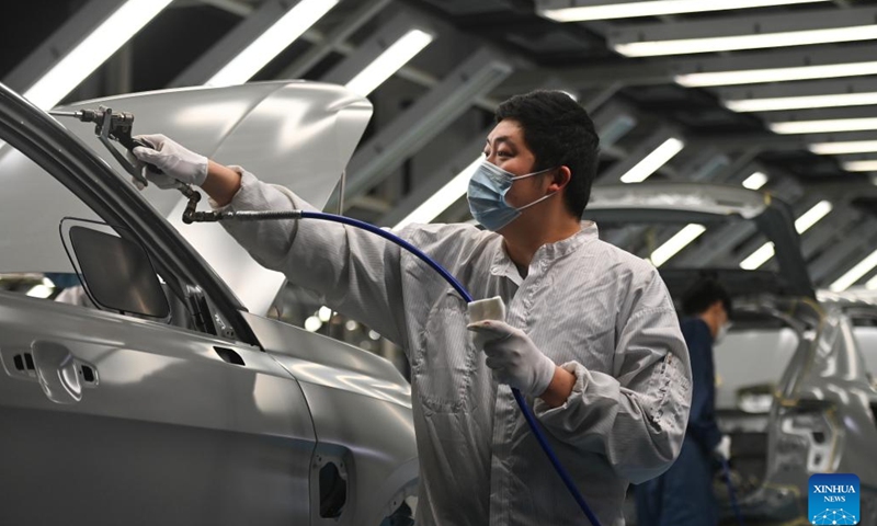 An employee works at an automobile company in Yuyao, east China's Zhejiang Province, Jan. 5, 2023. With production lines humming and machines running in full swing, factories across China have resumed busy operations after the country's latest optimization of COVID-19 response and a series of measures to accelerate production resumption.(Photo: Xinhua)