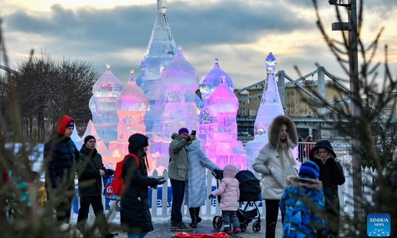 People visit an ice sculpture exhibition at a park in Moscow, Russia, on Jan. 5, 2023.(Photo: Xinhua)