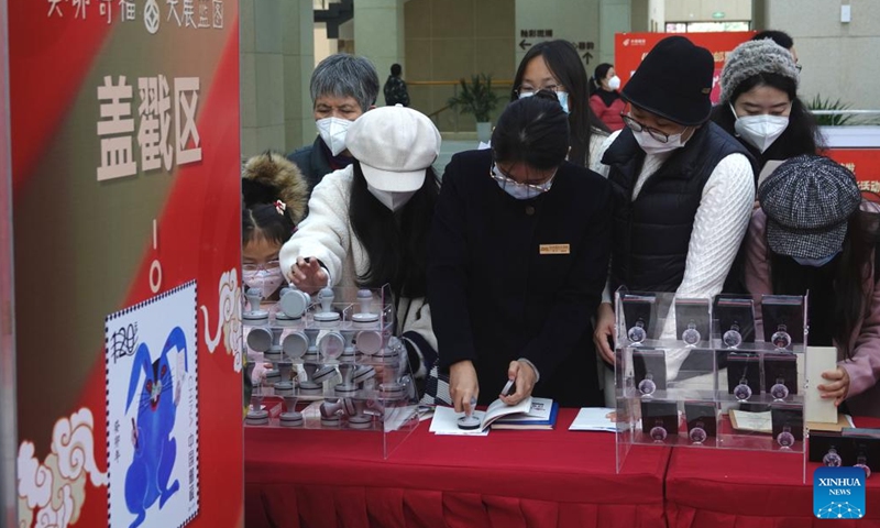 Philatelists collect commemorative postmarks after the release of the special stamps marking the Year of the Rabbit in Nanning, south China's Guangxi Zhuang Autonomous Region, Jan. 5, 2023. China Post on Thursday released a set of two special stamps to celebrate the upcoming Chinese zodiac Year of the Rabbit.(Photo: Xinhua)