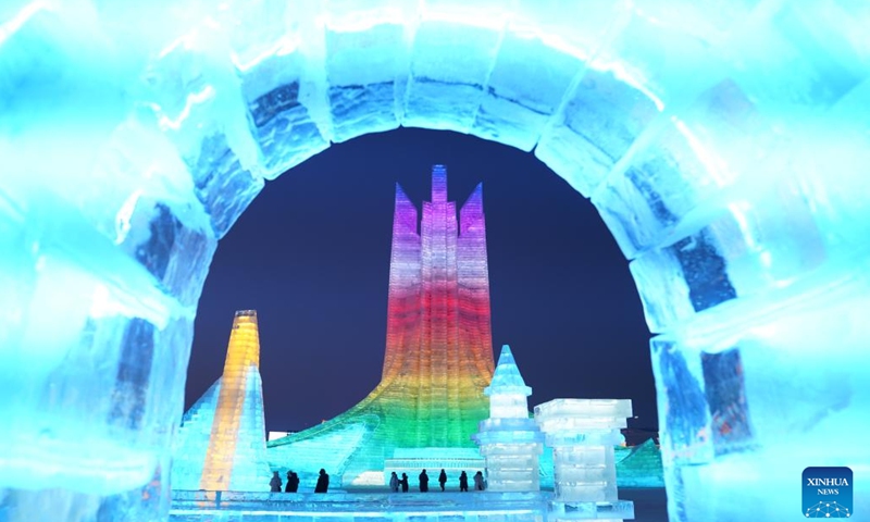 This photo taken on Jan. 5, 2023 shows tourists visiting the Harbin Ice-Snow World theme park in Harbin, northeast China's Heilongjiang Province. The opening ceremony of the 39th Harbin International Ice and Snow Festival was held on Thursday.(Photo: Xinhua)