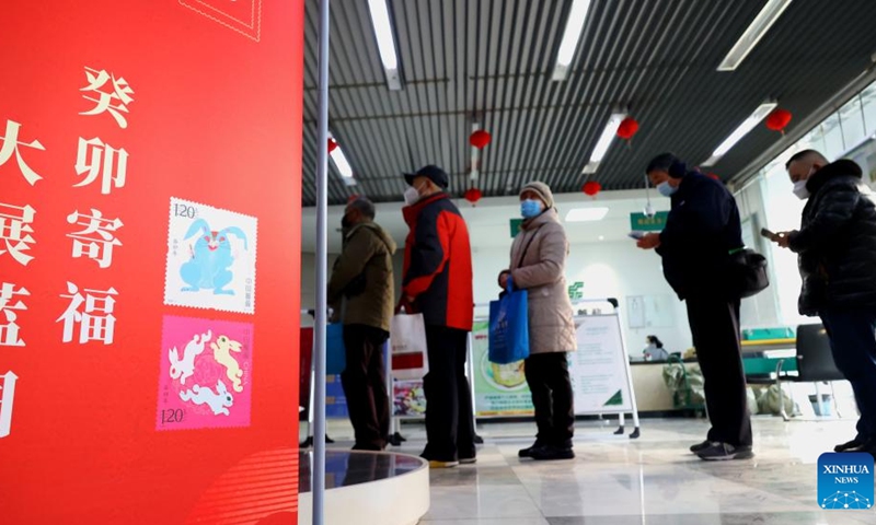 Stamp collectors queue up to buy the special stamps marking the Year of the Rabbit at a post office in Haizhou District of Lianyungang, east China's Jiangsu Province, Jan. 5, 2023. China Post on Thursday released a set of two special stamps to celebrate the upcoming Chinese zodiac Year of the Rabbit.(Photo: Xinhua)