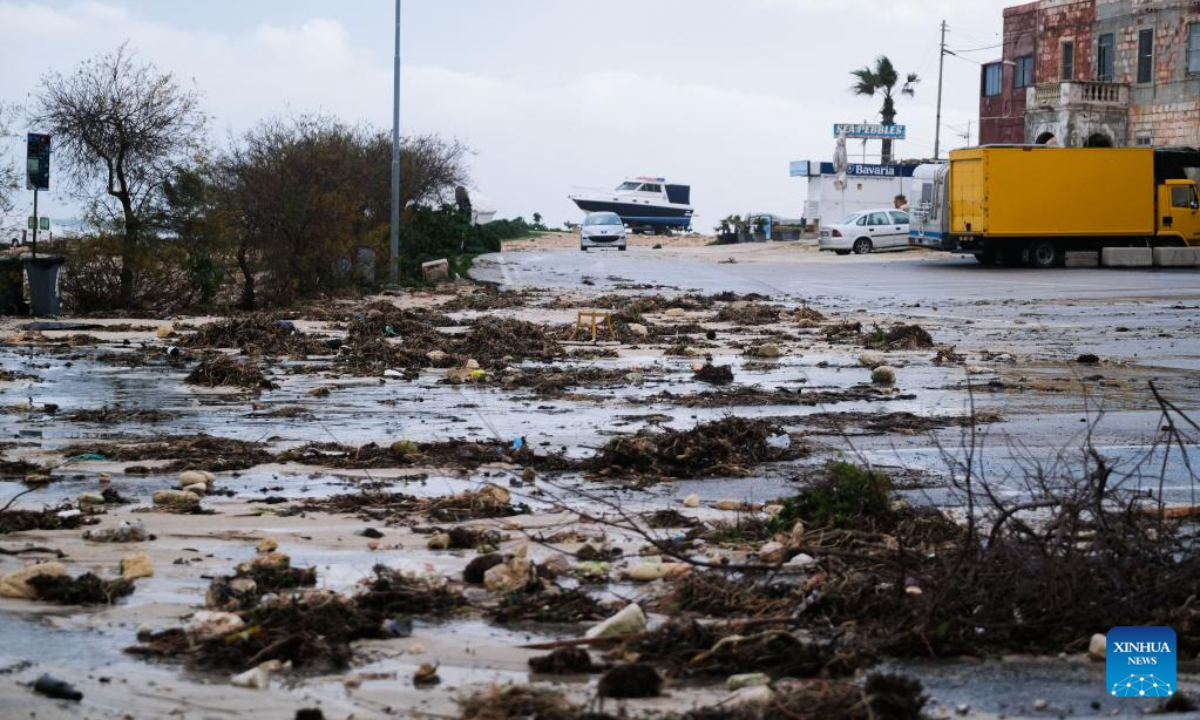 Debris brought up by strong waves is seen on a road in Bahar ic-Caghaq, Naxxar, Malta, on Feb 10, 2023. High winds and waves caused damage across Malta, including several historic sites, as storm Helios battered the island on Thursday and Friday. Photo:Xinhua