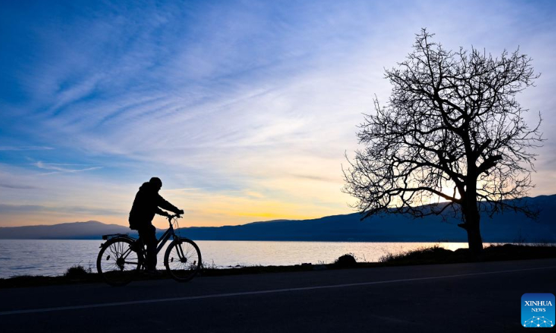 A person rides a bike on the shore of Ohrid Lake in Struga, North Macedonia, Feb. 18, 2023. Photo: Xinhua