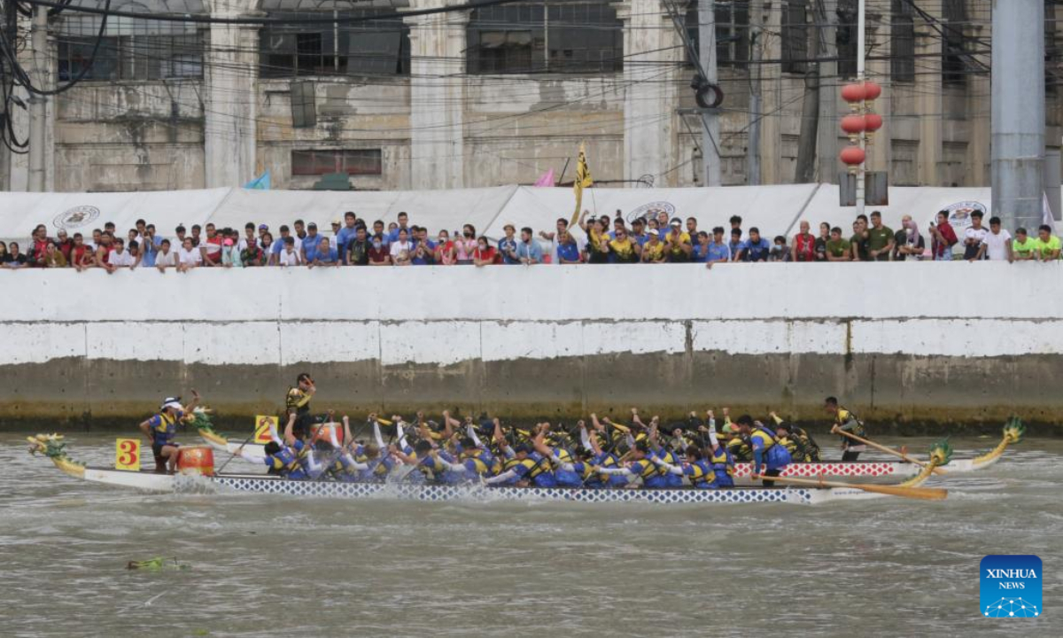 Rowing teams participate in a dragon boat race along Pasig River to celebrate the Chinese New Year in Manila, the Philippines, Jan 22, 2023. Photo:Xinhua