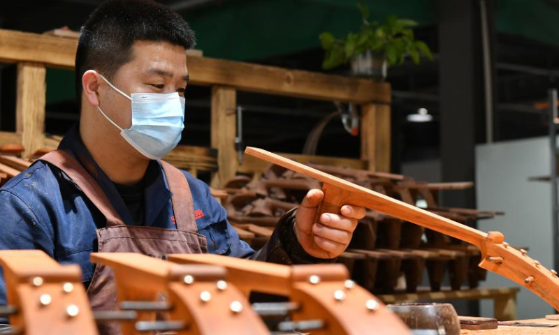 A worker makes components of traditional Chinese musical instrument at a workshop in Suning County, north China's Hebei Province, Feb. 18, 2023. Photo: Xinhua