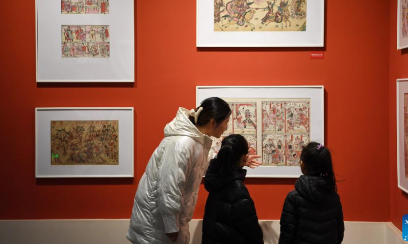 People visit the Wuqiang woodblock new year painting museum in Wuqiang County, north China's Hebei Province, Feb. 3, 2023. Wuqiang County has made efforts to pass on and promote the culture of Wuqiang woodblock new year painting, a national intangible cultural heritage listed in 2006. A series of cultural and creative products made with modern technology has been introduced to attract youngsters. Photo: Xinhua