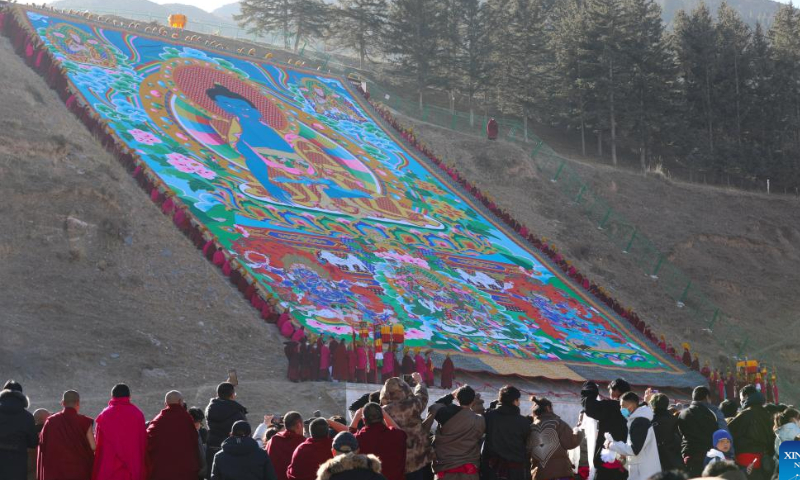 This photo taken on Feb. 3, 2023 shows the sunning of the Buddha ceremony at the Labrang Monastery in Xiahe County, northwest China's Gansu Province. Photo: Xinhua