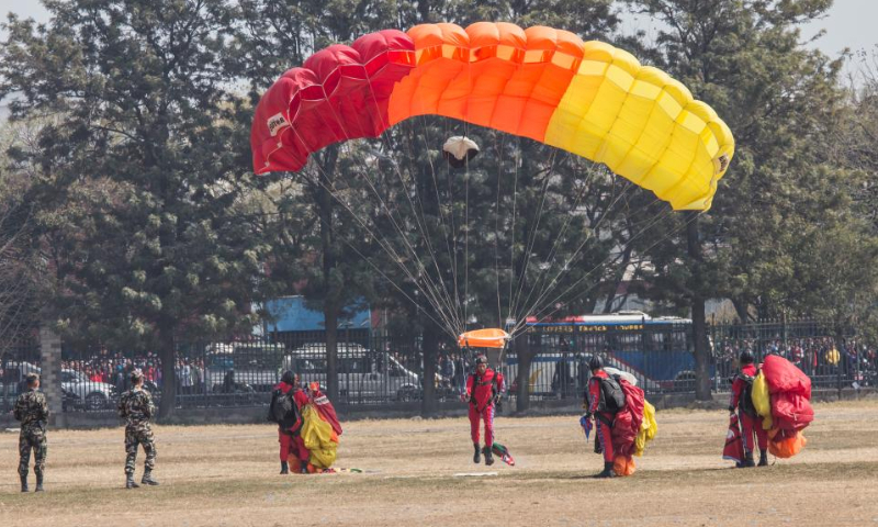 A Nepali paratrooper lands during an Army Day celebration at Tundikhel in Kathmandu, Nepal, Feb. 18, 2023. Photo: Xinhua