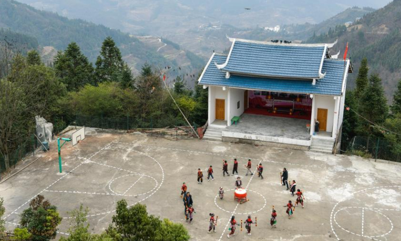 Students practice traditional dance of Yao ethnic group at the Zhongzhai education spot in Xishan Town of Congjiang County, Qiandongnan Miao and Dong Autonomous Prefecture, southwest China's Guizhou Province, Feb. 16, 2023. Zhongzhai education spot, located in the remote mountainous area of Guizhou Province, has only one teacher and 16 students of Yao ethnic group. In recent years, the conditions of this mini primary school have been greatly improved with the help of local government and community. Photo: Xinhua