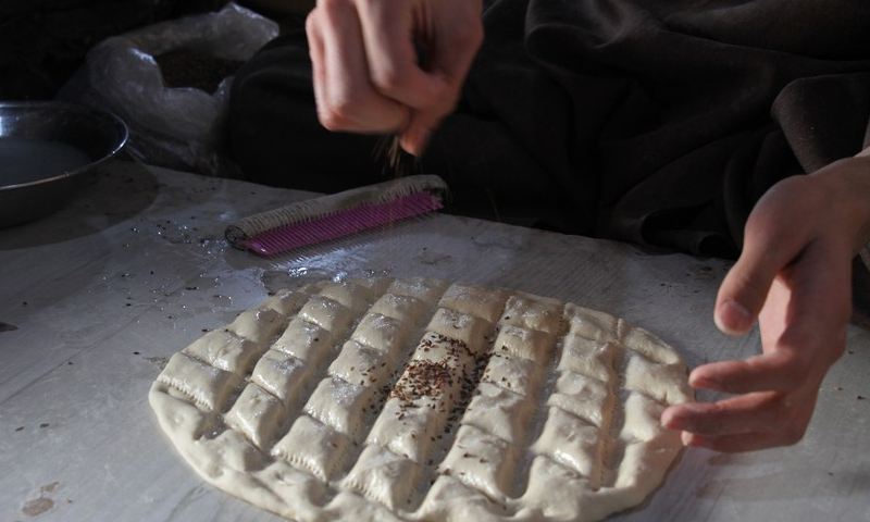 A man makes naan for sale at a bakery in Balkh province, Afghanistan on Jan. 24, 2023. Photo: Xinhua