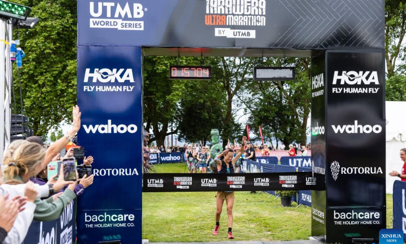 Nancy Jiang dashes to the line as she finishing the TUM 102 female event of the 2023 Tarawera Ultramarathon at mountain trails around Rotorua, in New Zealand, Feb. 11, 2023.Photo: Xinhua