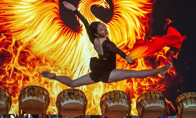 A dancer performs during a Lunar New Year celebration at Discovery Green in downtown Houston, the United States, on Jan. 22, 2023. The Lunar New Year celebration was held on Sunday at Discovery Green, a landmark public park in downtown Houston. (Photo by Chengyue Lao/Xinhua)