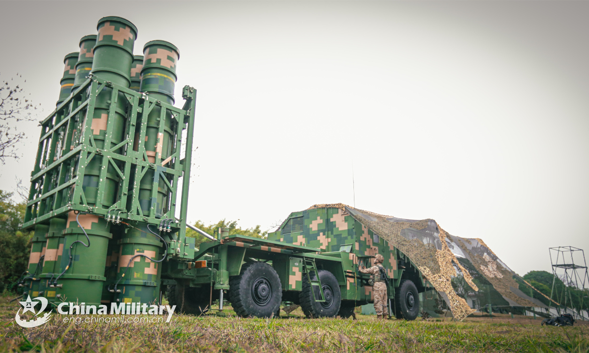 A soldier assigned to an air defense element under the PLA 75th Group Army checks the air-defense missile launch vehicle during a combat-readiness maneuvering exercise on January 20, 2023. Photo:China Military