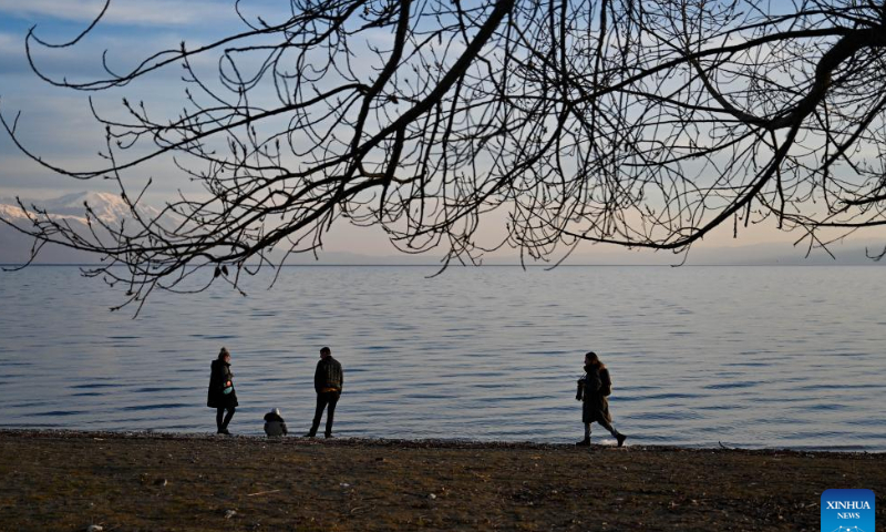 People walk on the shore of Ohrid Lake in Struga, North Macedonia, Feb. 18, 2023. Photo: Xinhua