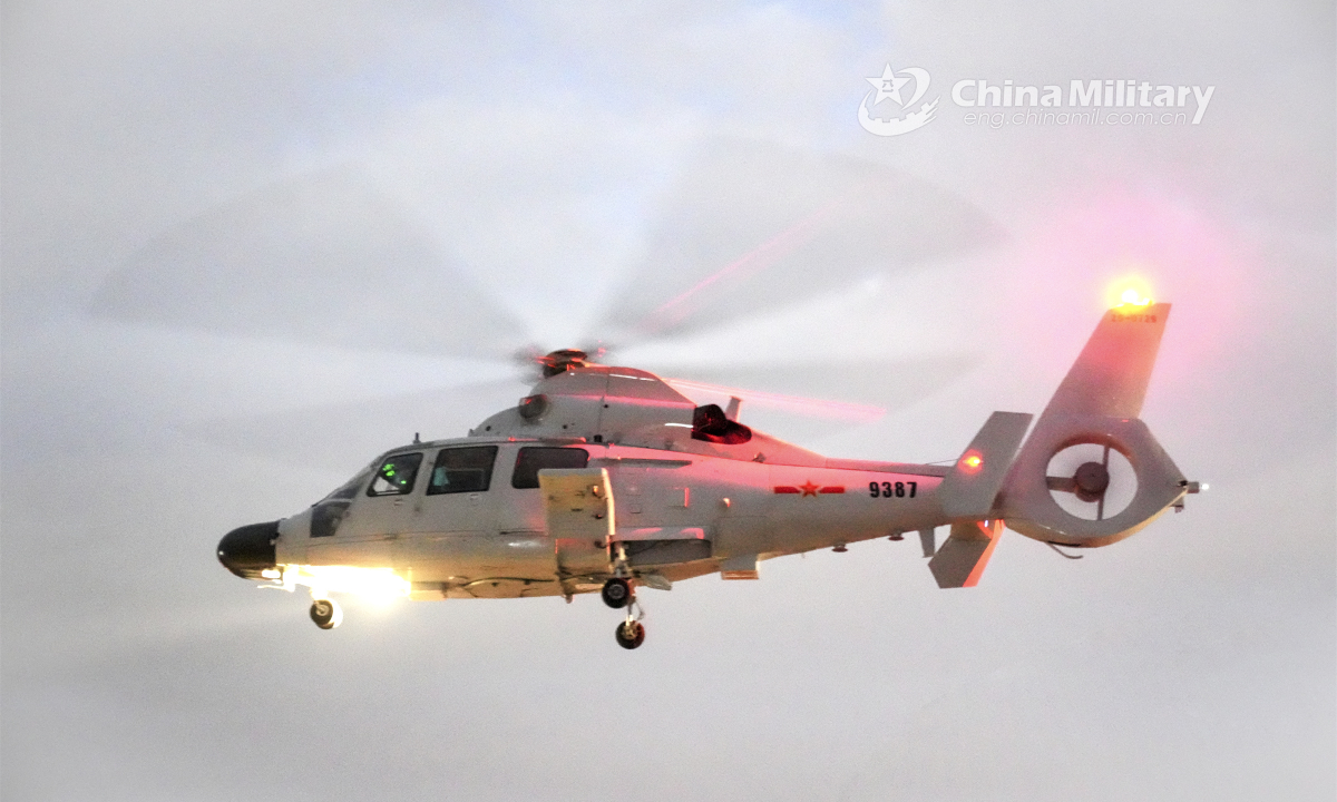 Three helicopters attached to a ship-borne helicopter regiment of the navy under the PLA Southern Theater Command hover in formation during a round-the-clock training exercise in late January, 2023. Photo: China Military