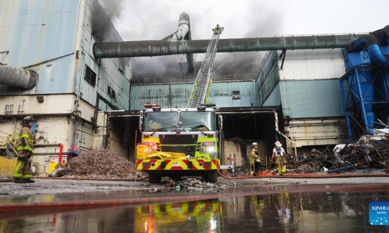 This image released by the Miami-Dade Fire Rescue shows firefighters working to contain a fire at a waste-to-energy facility in Doral, a city in Miami-Dade County, Florida, the United States, on Feb. 12, 2023. Photo: Xinhua