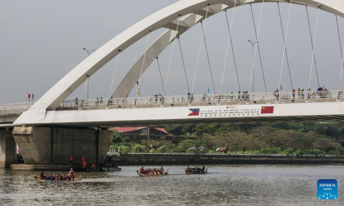 Rowing teams participate in a dragon boat race along Pasig River to celebrate the Chinese New Year in Manila, the Philippines, Jan 22, 2023. Photo:Xinhua