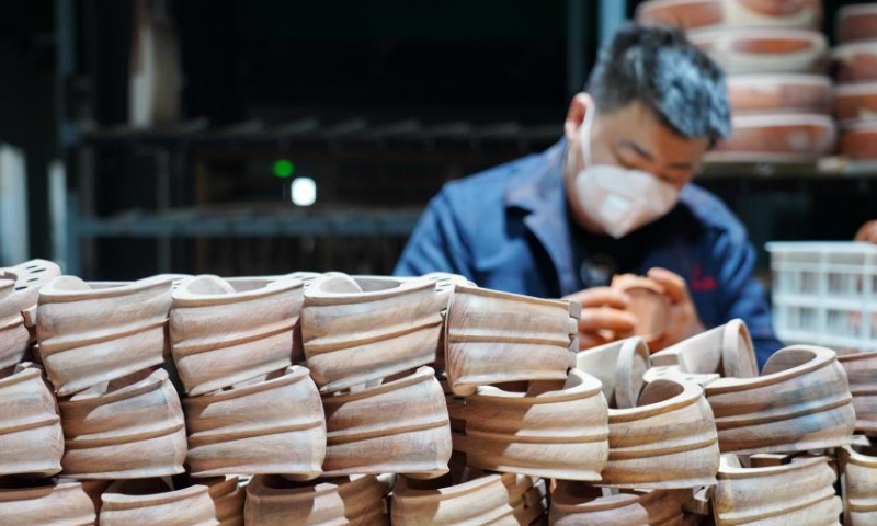 A worker makes components of traditional Chinese musical instrument at a workshop in Suning County, north China's Hebei Province, Feb. 18, 2023. Photo: Xinhua