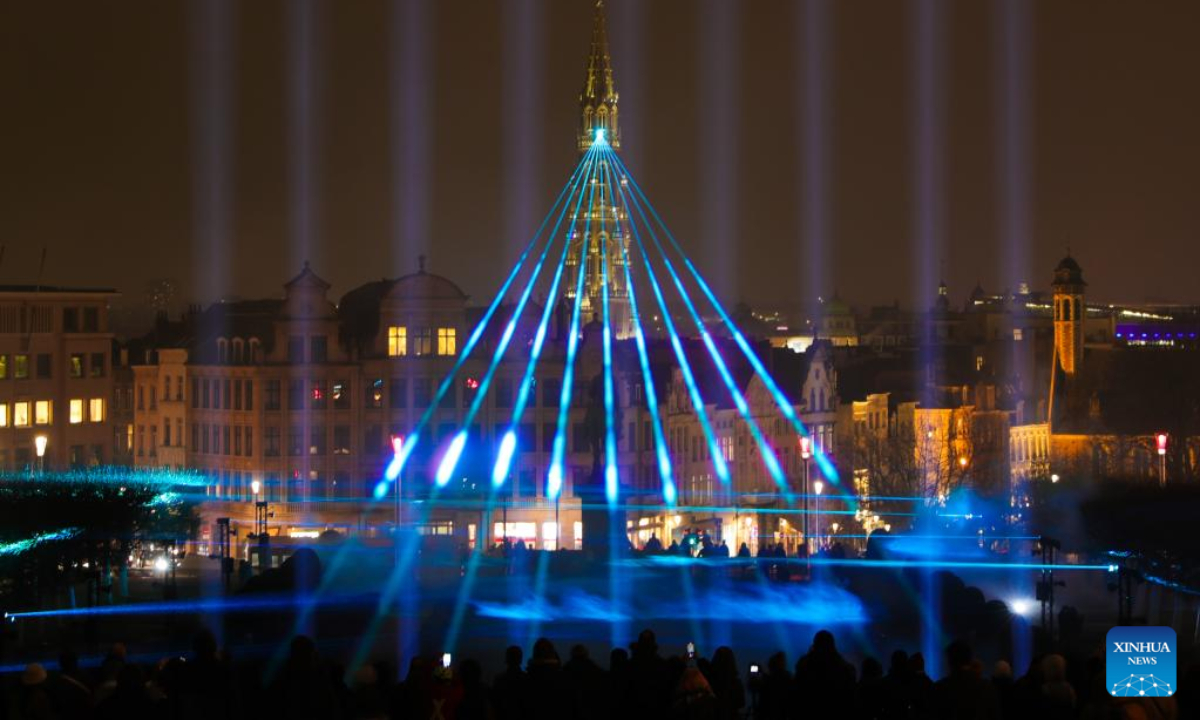 People watch a light show during the Bright Festival, the Brussels Festival of Light, in Brussels, Belgium, Feb 16, 2023. Some twenty artistic light installations were set up to decorate the capital of Belgium during the festival, which is to be held from Feb 16 to 19. Photo:Xinhua