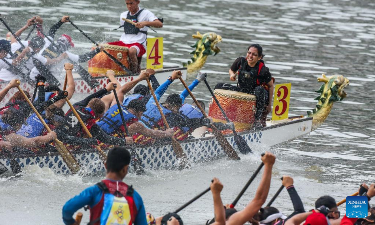 Rowing teams participate in a dragon boat race along Pasig River to celebrate the Chinese New Year in Manila, the Philippines, Jan 22, 2023. Photo:Xinhua