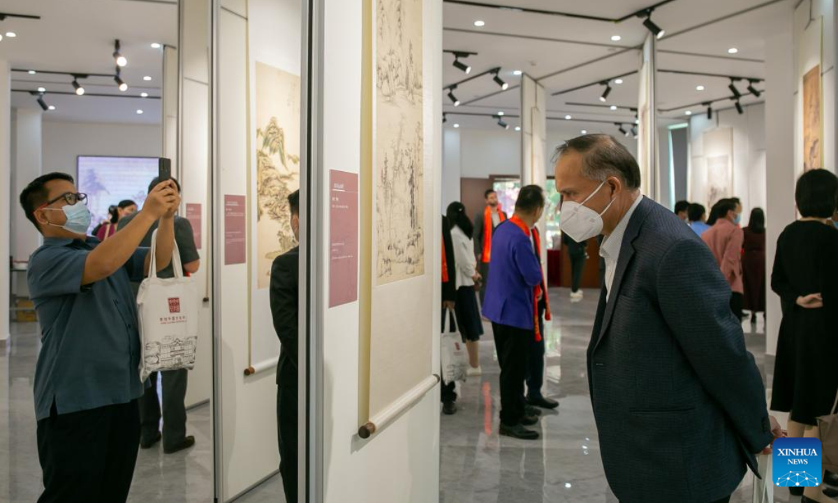 Visitors watch the works of the Ancient Chinese Landscape Painting Exhibition themed 