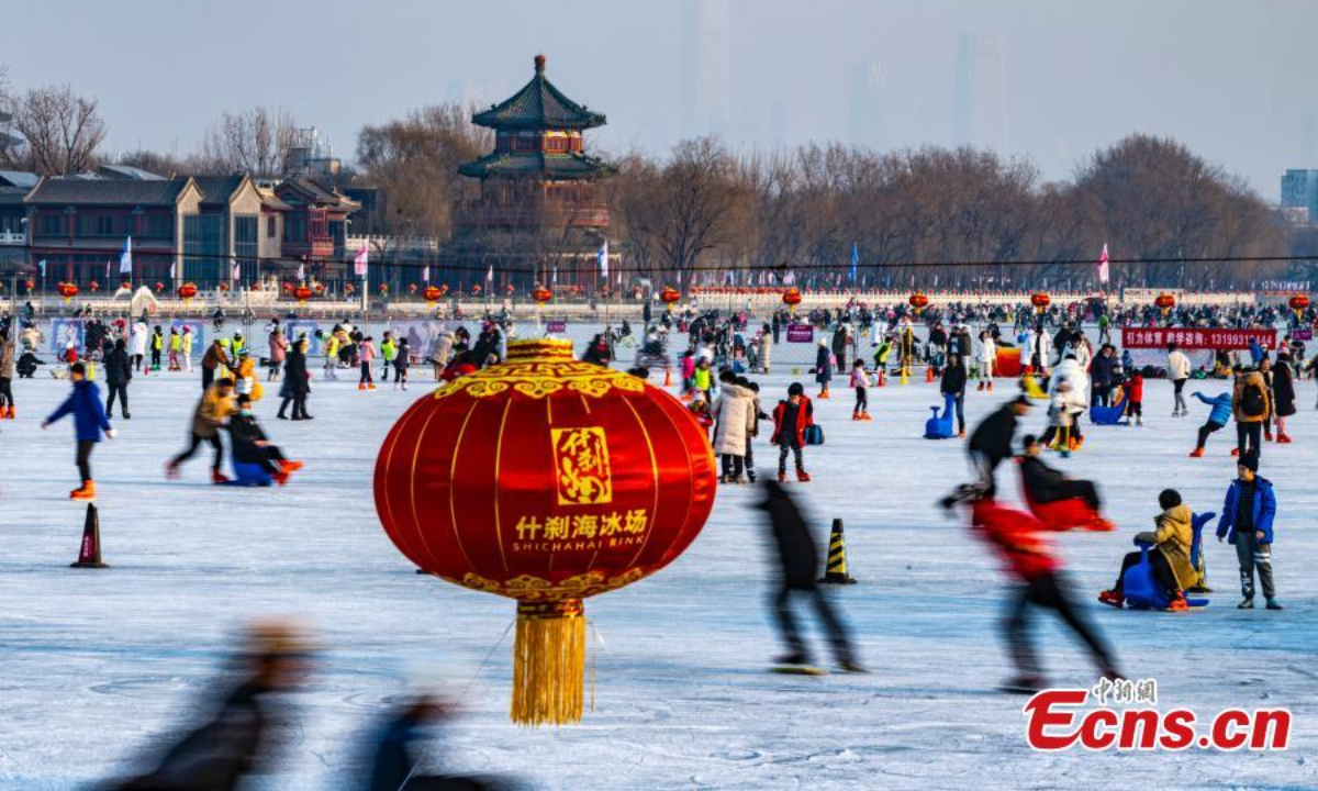 People skate and sled on the ice of Shichahai lake, a popular scenic area in Beijing during Minor Cold, or Xiaohan, the 23rd solar term of the 24 traditional Chinese solar terms, Jan 5, 2023. Photo:China News Service