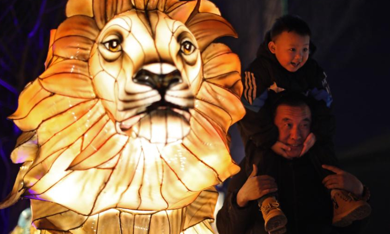 Tourists pose for photos at Liaohe ancient street in Yingkou, northeast China's Liaoning Province, Feb. 3, 2023. The Liaohe ancient street has been decorated with various lanterns to greet the Lantern Festival, the 15th day of the first month of the Chinese lunar calendar, which falls on Feb. 5 this year. Photo: Xinhua