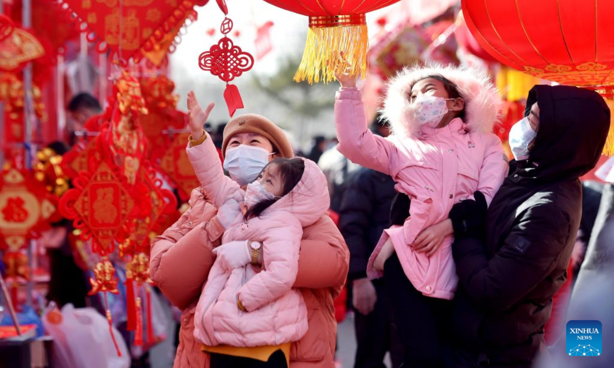 People select new year decorations at a market in Zhengding County of Shijiazhuang, north China's Hebei Province, Jan 18, 2023. Photo:Xinhua