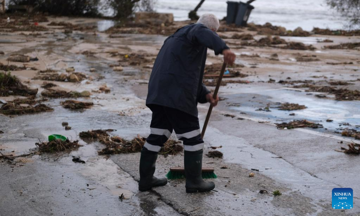A man clears debris brought up by strong waves in Bahar ic-Caghaq, Naxxar, Malta, on Feb 10, 2023. High winds and waves caused damage across Malta, including several historic sites, as storm Helios battered the island on Thursday and Friday. Photo:Xinhua