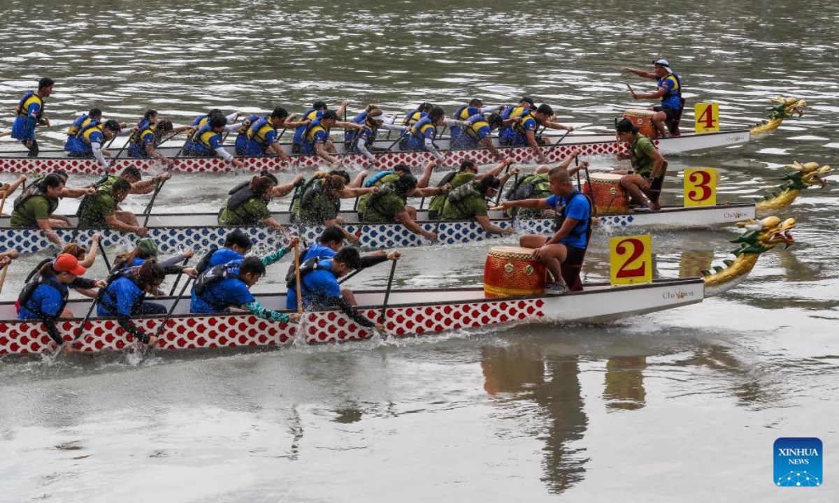 Rowing teams participate in a dragon boat race along Pasig River to celebrate the Chinese New Year in Manila, the Philippines, Jan 22, 2023. Photo:Xinhua