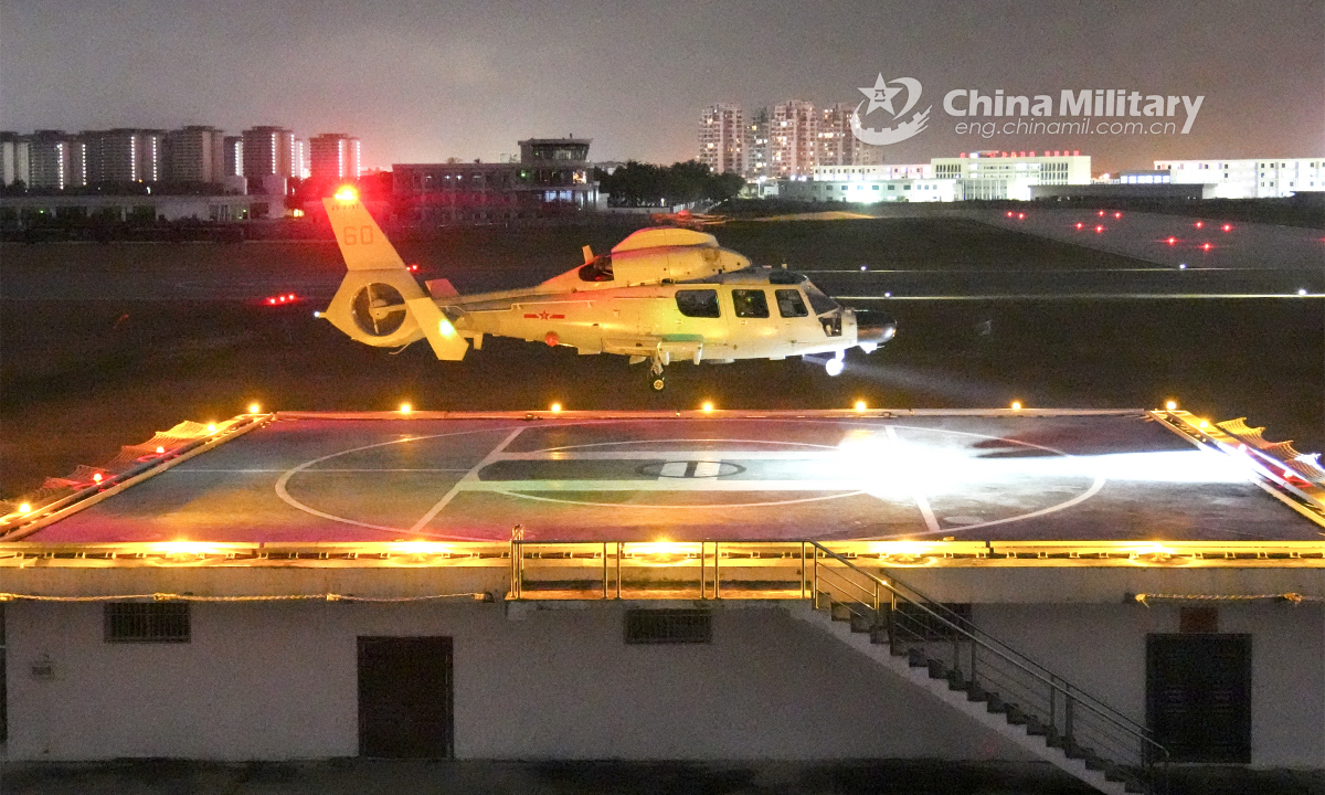 Three helicopters attached to a ship-borne helicopter regiment of the navy under the PLA Southern Theater Command hover in formation during a round-the-clock training exercise in late January, 2023. Photo: China Military