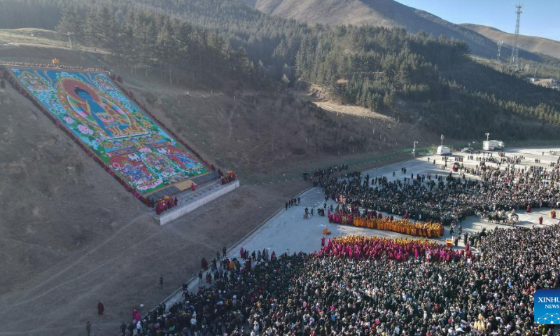 This aerial photo taken on Feb. 3, 2023 shows the sunning of the Buddha ceremony at the Labrang Monastery in Xiahe County, northwest China's Gansu Province. Photo: Xinhua