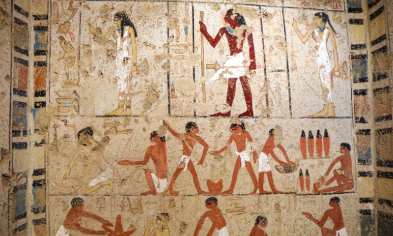 Photo taken on Jan. 26, 2023 shows colored paintings on a wall inside a newly-discovered ancient tomb in Saqqara necropolis, south of Cairo, Egypt. Egypt's renowned archeologist Zahi Hawass on Thursday announced the discovery of 
