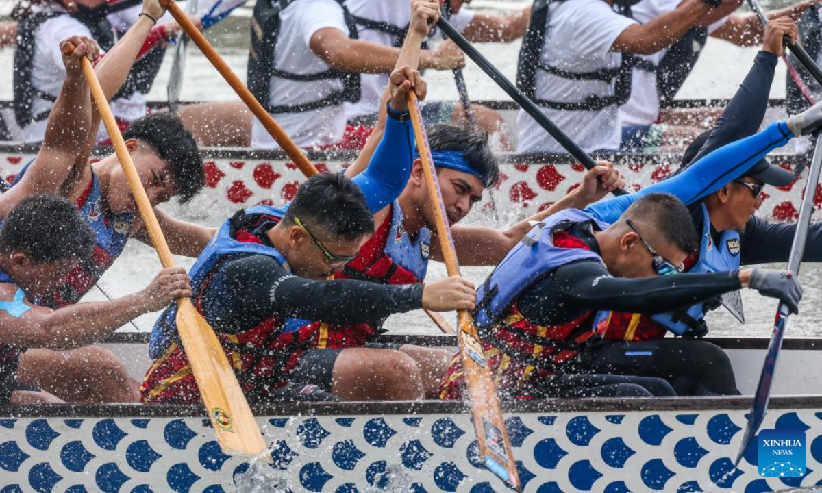 Rowing teams participate in a dragon boat race along Pasig River to celebrate the Chinese New Year in Manila, the Philippines, Jan 22, 2023. Photo:Xinhua