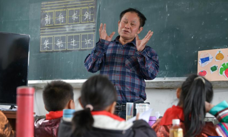 Teacher Meng Rongda gives a lesson at the Zhongzhai education spot in Xishan Town of Congjiang County, Qiandongnan Miao and Dong Autonomous Prefecture, southwest China's Guizhou Province, Feb. 16, 2023. Zhongzhai education spot, located in the remote mountainous area of Guizhou Province, has only one teacher and 16 students of Yao ethnic group. In recent years, the conditions of this mini primary school have been greatly improved with the help of local government and community. Photo: Xinhua