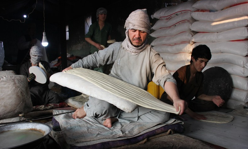 People make naan for sale at a bakery in Balkh province, Afghanistan on Jan. 24, 2023. Photo: Xinhua