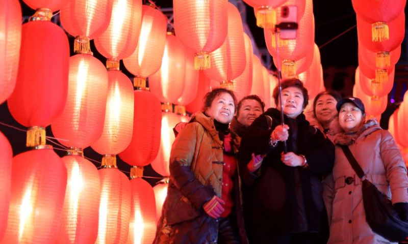 Tourists pose for photos at Liaohe ancient street in Yingkou, northeast China's Liaoning Province, Feb. 3, 2023. The Liaohe ancient street has been decorated with various lanterns to greet the Lantern Festival, the 15th day of the first month of the Chinese lunar calendar, which falls on Feb. 5 this year. Photo: Xinhua