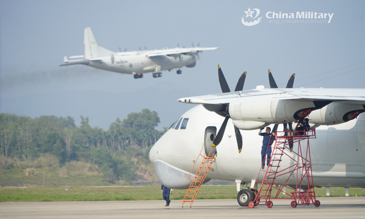 Ground crew members assigned to an aviation regiment of the naval force under the PLA Southern Theater Command maintain an antisubmarine aircraft during an antisubmarine flight training exercise in late December, 2022. Photo: China Military