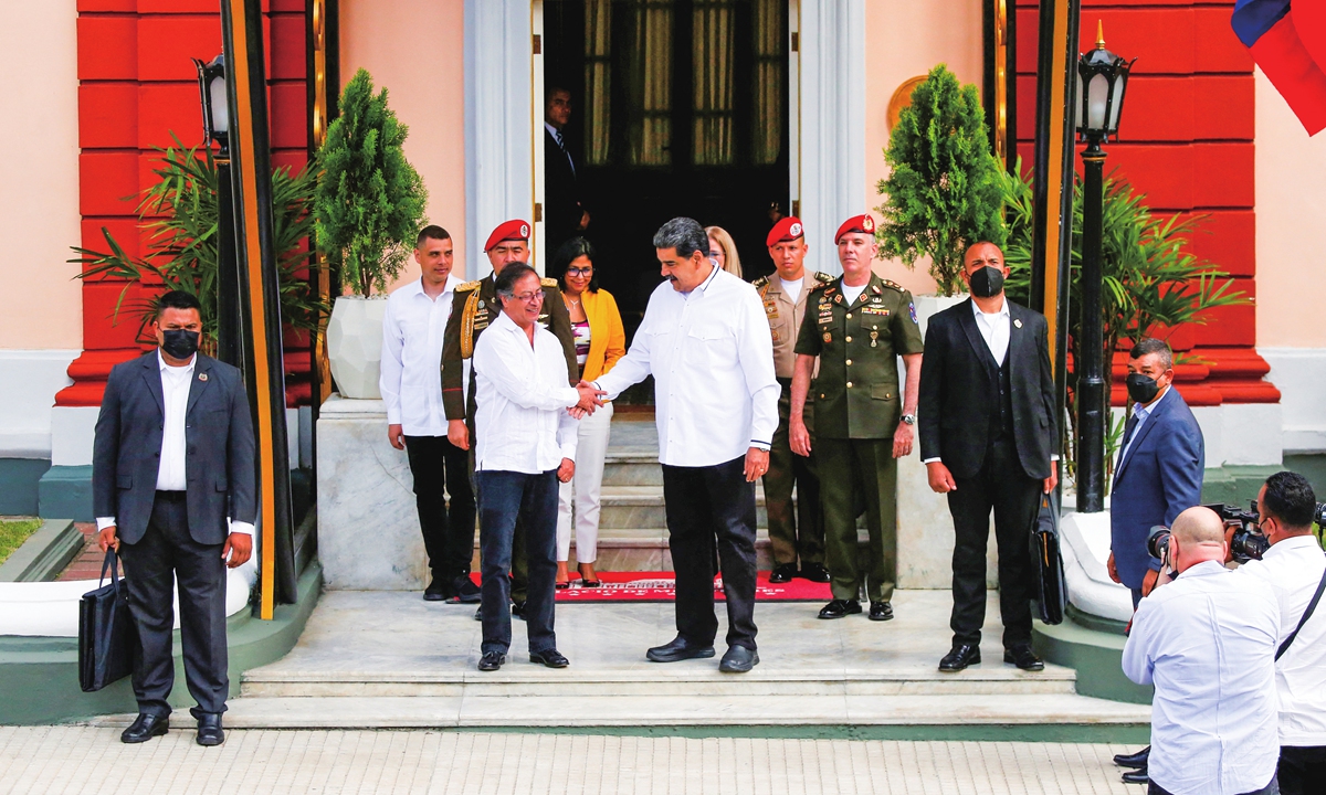 Venezuelan President Nicolas Maduro (right) and his Colombian counterpart Gustavo Petro shake hands at Miraflores Palace, in Caracas, Venezuela on January 7, 2023. The two sides discussed bilateral investment and trade at the meeting. The countries have renewed political ties since Petro took office in August 2022. Photo: IC