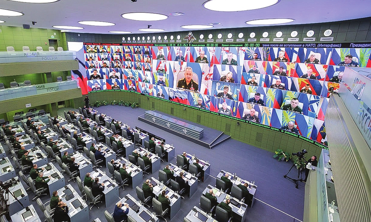 Russian Defense Minister Sergey Shoigu (center on the screen) speaks to senior Russian military officers via video link at an annual ministry conference on January 10, 2023. 