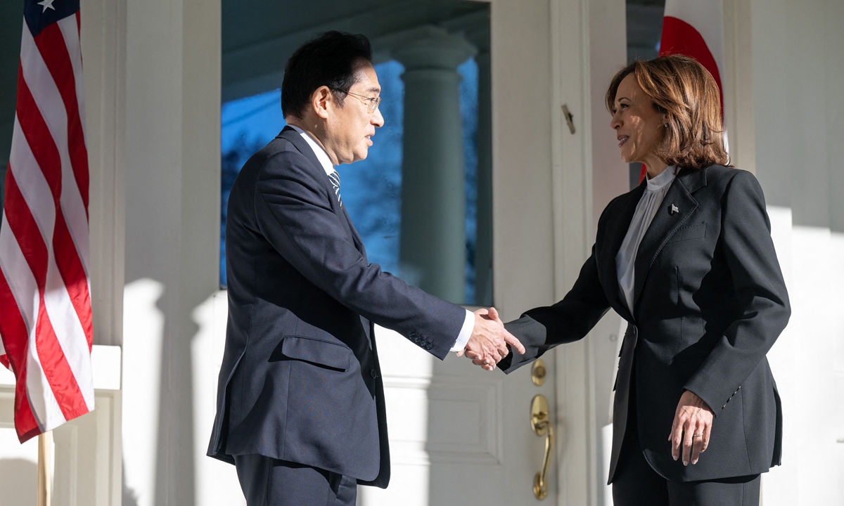 US Vice President Kamala Harris greets Japanese Prime Minister Fumio Kishida prior to a breakfast meeting at the Vice President's Residence at the Naval Observatory in Washington, DC on January 13, 2023.