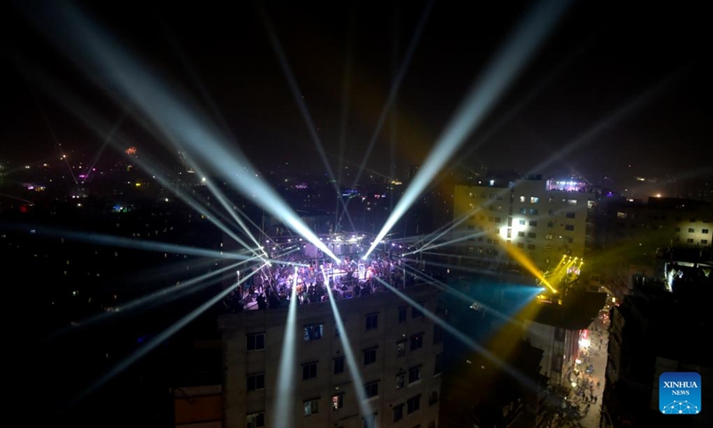 People gather on a roof to celebrate Sakrain festival in Dhaka, capital of Bangladesh, Jan. 14, 2023. People in Dhaka celebrate Sakrain festival, also known as Ghuri Utsob or Kite festival, at the end of Poush, the ninth month of the Bengali calendar. Photo: Xinhua